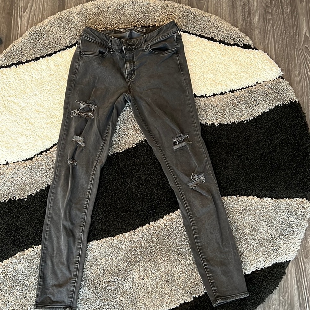 Washed out black ripped jeans. Size 10